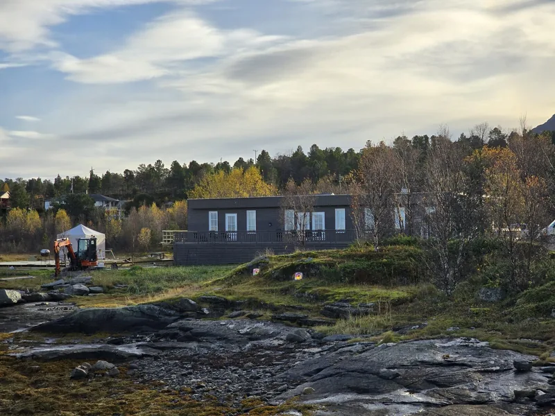 The Troll Havn buildings by the water in autumn
